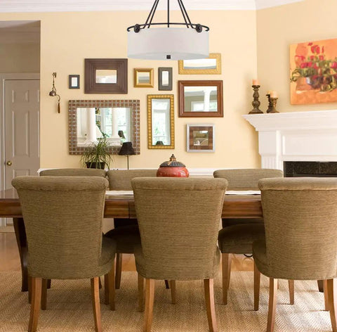 Dining room with Gramercy Park One Light Pendant In Old English Bronze With Blown Hammered Glass, illuminating the space.