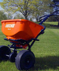 60 Lb Heavy Duty Spreader Workhorse RB60 on lush lawn with sturdy metal frame, durable black finish, wide seed capacity