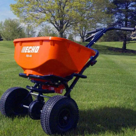 60 Lb Heavy Duty Spreader Workhorse RB60 on lush lawn with sturdy metal frame, durable black finish, wide seed capacity