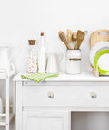 Brushed Nickel Round Cabinet Knobs Featuring Solid Zinc Construction And Easy Grip Design, 15 Pack displayed on white kitchen cabinet.