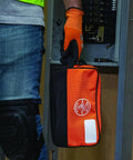Heavy Duty Tool Pouch With Dual Compartments For Quick Organization Of Meters Leads Sockets Wrenches And Small Parts In A Tough As Nails Multipurpose Tool Bag You Can Count On held by a worker in front of an electrical panel