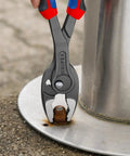 TwinGrip Pliers With Comfort Grip Handles gripping a nut, showing pro-grade performance for electricians and DIYers, 10-inch tool.