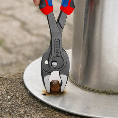 TwinGrip Pliers With Comfort Grip Handles gripping a nut, showing pro-grade performance for electricians and DIYers, 10-inch tool.
