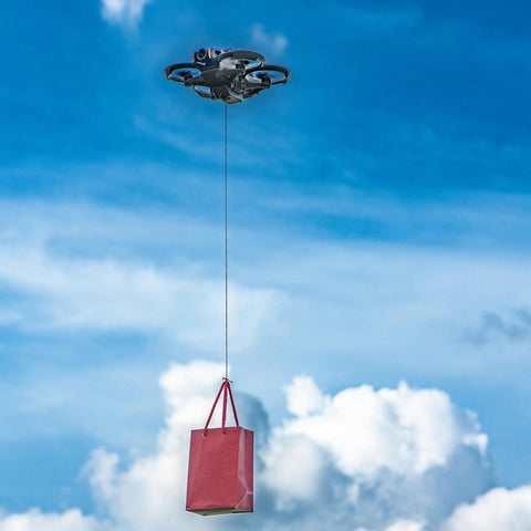 Avata 2 Drone Action Camera Mount Holder for DJI Action 5 carrying a red bag in the sky against a cloud background.