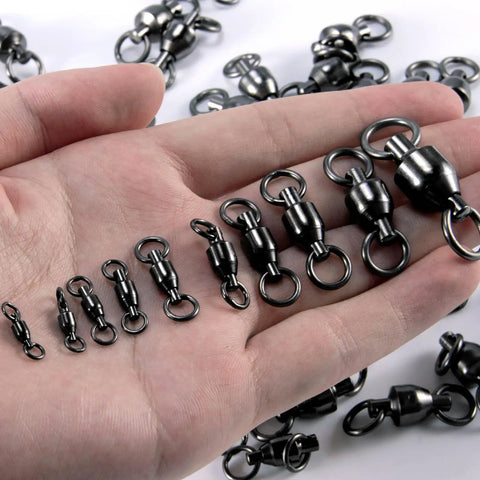 30 Pack Ball Bearing Swivels For Fishing Tackle Heavy Duty Stainless Steel Welded Rings Barrel Swivel Hook Line Connector With Black Nickel Coating Saltwater And Freshwater Ready Size 0 Twist Free 360 Degree Rotation, shown in hand