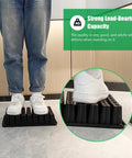 Person standing on 54 Cell Seed Starter Tray Set 2.8 Inch Deep Plug Trays, demonstrating durable heavy-duty material on tiled floor.