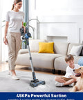 Woman using Cordless Vacuum Cleaner With 8 In 1 Versatility Lightweight Beast Mode Suction For Home on carpet near sofa and child.
