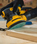 Heavy Duty 5 Inch Random Orbital Sander Replacement Pad 2 Pack Featuring Tough Pu Backing used on wood surface for precise sanding.