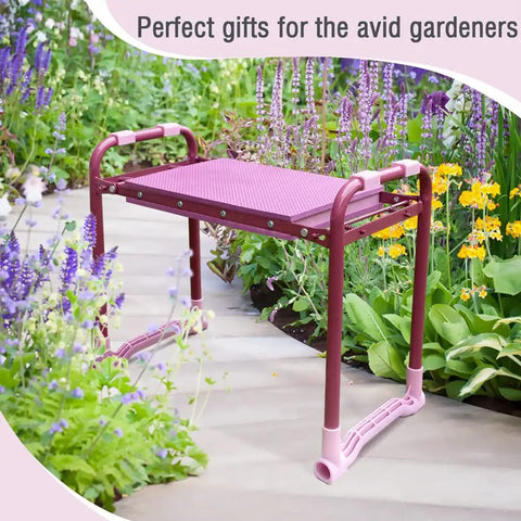 Side view of the Upgraded Garden Kneeler And Seat With Rugged Steel Frame in a garden path, highlighted among flowers.