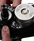 Intermatic PE24GVA 24V compact valve actuator — close-up of gear train, motor, and wiring.