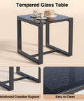 Glass table from Three Piece Patio Rocking Bistro Set with coffee cups and dishes, showcasing reinforced support and easy-to-clean surface.