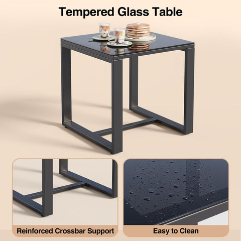 Glass table from Three Piece Patio Rocking Bistro Set with coffee cups and dishes, showcasing reinforced support and easy-to-clean surface.