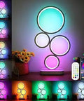 Smart RGB Table Lamp With App Control And Remote Dimmable Ambient Vibe Lighting Built In Wireless Charger Scene And Music Modes, white 19-inch lamp with colorful rings.
