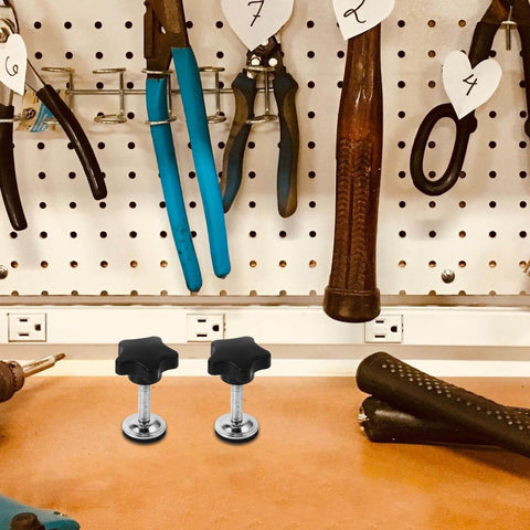 Star Handle Pressure Plate Adjustment Screws With Washers And Nuts on workbench, surrounded by tools, in workshop setting