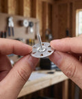 Heavy Duty Metal Washers For Foam Board Insulation Kit With Screws 1.4 Inch Diameter Silver That Help Prevent Cracking And Wall Stress In Partition Installations With Load Spreading Foam Panel Washers For A Tight Secure Fix Built To Last., silver washer with screw held in hands