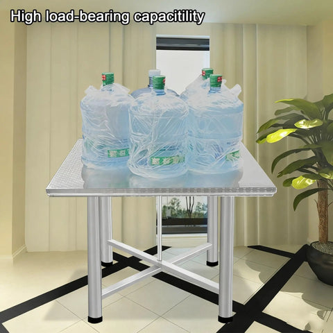 Heavy Duty Foldable Stainless Steel Workbench With Reinforced Crossbeams Thickened Square Countertop holding water bottles, showcasing high load-bearing capacity.