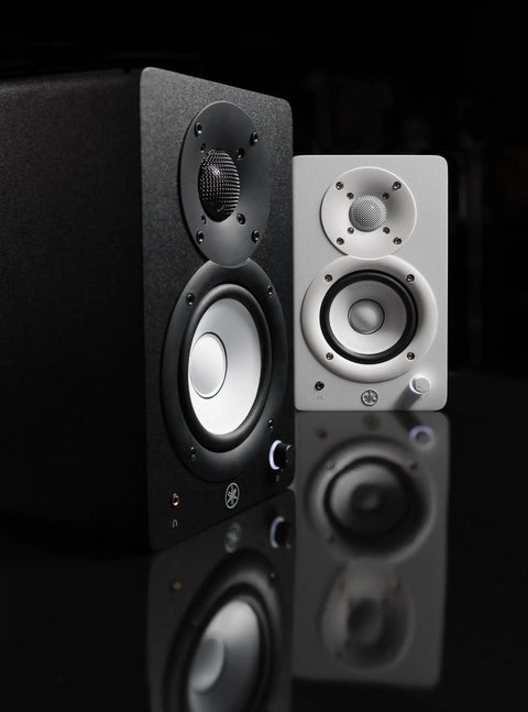 HS4 Black Powered Studio Monitors Pair With 4.5 Inch Woofer And 1 Inch Dome Tweeter 60 Hz To 22 kHz 26W Output Room Control And High Trim XLR TRS RCA And Stereo Mini Inputs Killer For Home Studio Mixing showing black and white units on reflective surface
