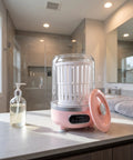 Zero Drama Portable Usb Rechargeable Mini Underwear Washer Slick Compact 3L on bathroom counter with soap dispenser nearby.