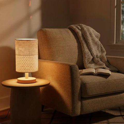 Table Desk Lamp With Brown Knit Fabric Shade Solid Wood Base Boho Nightstand Lamp For Bedroom Living Room, turned on beside armchair.