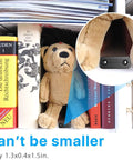 Smallest Wireless WiFi Hidden Camera with 1080P HD Video Live Feed Portable Nanny Cam placed on a shelf next to books and a toy.