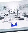 Blue educational Newtonian pendulum swing tool for physics experiments on a science lab counter.