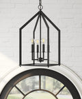 Chic Rustic Black 4 Light Chandelier With Metal Cage Pendant Adjustable Chain Hanging Light Fixture For Kitchen Island And Dining Room Farmhouse Lantern Style Ceiling Light With Modern Industrial Edge hanging against brick wall