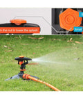 360 Degree Yard Sprinkler With Adjustable 45 To 90 Degree Spray, rotating on grass attached to garden hose, adjusting nut close-up