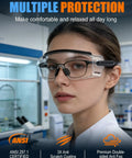 Boss Level Safety Glasses Over Eyeglasses With Hella Good Anti Fog Coating, Ansi Z87.1 Certified Eye Shield, Super Roomy Fit For Your Specs, 2 Pack Ready, Kick Butt Protection For Grinding And Construction, Smooth Sleek Design, worn by a woman in a lab setting.