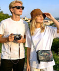 Two travelers outdoors, woman holding Family Passport Wallet With Five Passport Slots And Card Slots, RFID Blocking Lining
