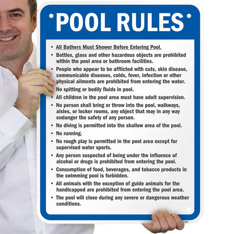 Person holding Pool Rules Sign 24 X 18 Inch Must Shower No Spitting No Diving No Running Aluminum Exterior Sign 80 Mil