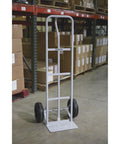 Heavy Duty Steel Hand Truck with 600 Pound Capacity and 10 Inch Flat Free Tires, P Style Handle in warehouse setting.