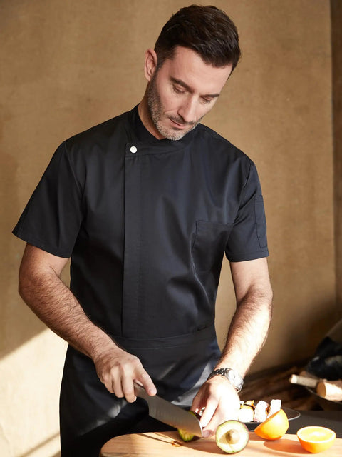 Kickass Black Men Chef Coat With Dope Breathable Mesh Short Sleeve Lightweight Jacket For Kitchen And Bakery Uniform Featuring Slick Oblique Collar And Handy Sleeve Pocket For Hitting The Heat, chef slicing avocado.
