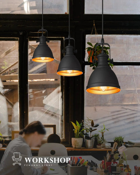 Sunrise Inspired Modern Pendant Lights Set Of 2 Black And Orange Gold Metal Hanging Fixtures For Kitchen Island With Sanded Texture Finish Industrial Urban Style AD 2151 1P2 illuminating a workspace.