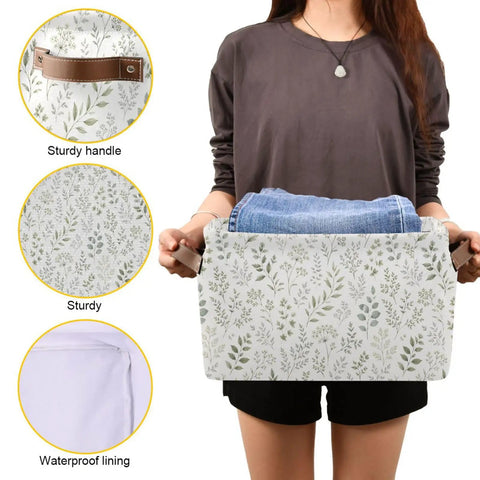 Built Different Grey Leafy Vines Canvas Storage Baskets With Double Stitched Handles Generous Foldable Fabric Bins For Closets And Shelves in use, holding jeans, featuring waterproof lining.