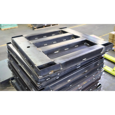 Heavy Duty Digital Pallet Scale With 5000 Pound Capacity And Roomy 48 By 48 Deck stacked metal pallets in warehouse setting.