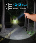 Person using 6000 Lumen Waterproof Marine Spotlight With Rechargeable LED Battery, Detachable Red Filter, shining down a forest path.