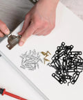 Rock Solid Heavy Duty 30 Piece Invisible Cabinet Connector Set Featuring 2 In 1 Iron Hidden Joint Fasteners on a work surface with screws.