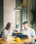 Straight Fire Vibe For Your Home Decor Featuring Fresh Saturn Ring Pendant Light With Remote Dimming And Sleek Black Overhead Ceiling Fixture For Kitchen Or Dining Room in a warm dining space.