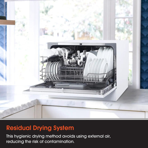 Open Real Deal Compact Countertop Dishwasher For Modern Kitchens showing clean plates and utensils stored for drying.