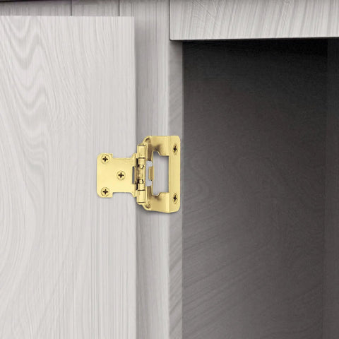 50 Pack Of 25 Pairs One Half Inch Overlay Self Closing Cabinet Hinges In Tough As Nails Polished Brass Gold Finish installed on kitchen cupboard.