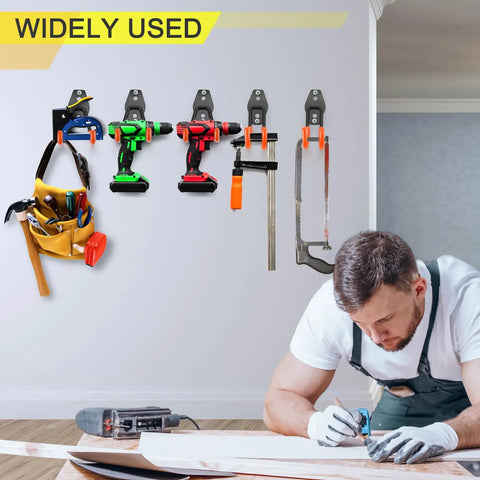 Garage displaying Two Pack Heavy Duty Garage Hooks For Wall Mount Storage, holding tools, ropes, and equipment on a wall.