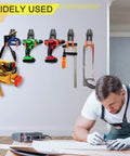 Man using tools in workshop with Beefy Heavy Duty Garage Hook Set 2 Pack Wall Mount Tool Hangers for organizing equipment on the wall.