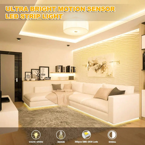 Motion Activated LED Light Strip 16.4ft With Day Or Night Modes illuminating a modern living room with white couch and warm white light