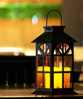 Solar Lantern Outdoor Waterproof Hanging Light For Garden Patio And Porch With Flickering LED Flames on table at night