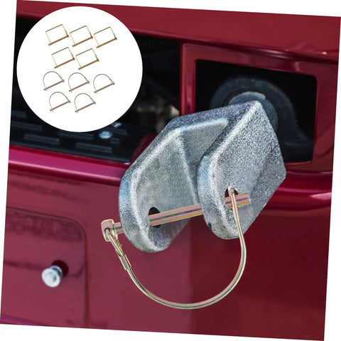 Heavy duty shaft locking pin from 10 Piece Farm Utility Trailer Linch Pin Set attached to red hitch for secure locking.