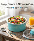 Electric Salad Spinner And Produce Washer To Wash And Spin Dry Leafy Greens Berries Or Fresh Veggies Fast With A Steady Non Slip Base That Makes Kitchen Cooking And Cleanup Totally Hassle Free In Blue with salad and tools on a wooden table.