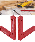 Sturdy Right Angle Clamps 2 Pack Aluminum Alloy Positioning Tools For Woodworking And Crafts To Make Perfect Square Corners Every Time With Clear Red Measurement Scale For Pros Who Need Reliable Balance And Precision On The Job Site Now on a workspace with wood and tools.