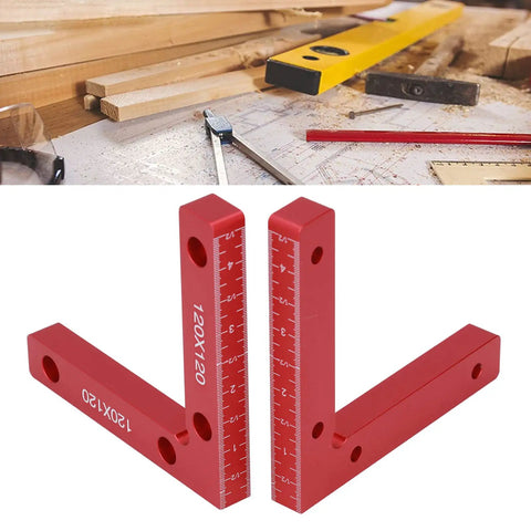 Sturdy Right Angle Clamps 2 Pack Aluminum Alloy Positioning Tools For Woodworking And Crafts To Make Perfect Square Corners Every Time With Clear Red Measurement Scale For Pros Who Need Reliable Balance And Precision On The Job Site Now on a workspace with wood and tools.