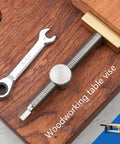 Professional Grade Woodworking Table Vise With Tenon Stop Strip Rock Steady Bench Fixture For Hardcore Carpenter And Machinist Shop Rig Built Tough Brass Workshop Clamp on wooden surface with wrench.