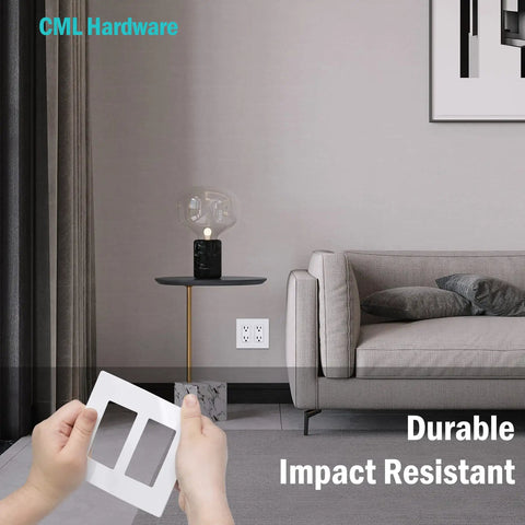 Hands holding Screwless Decorator Wall Plate 2 Gang Outlet Covers Four Pack White Standard Size 4.68 by 4.72 Inches in living room.